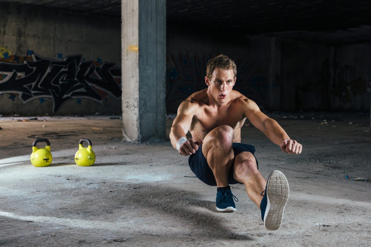 strong man squatting in abandoned building P7K54HR 1200x800 | Sarms Central